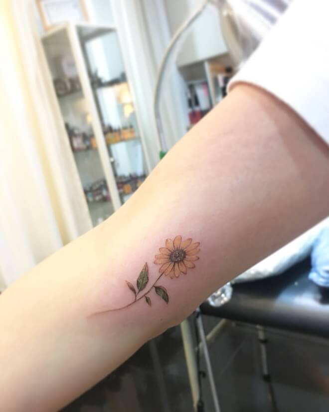 Minimalist Sunflower Lotus Tattoo