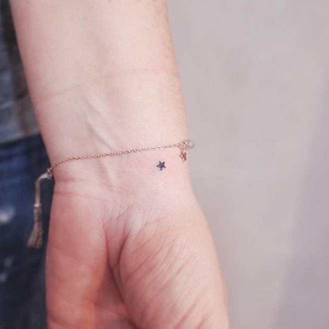 Small Star In Hand Tattoo