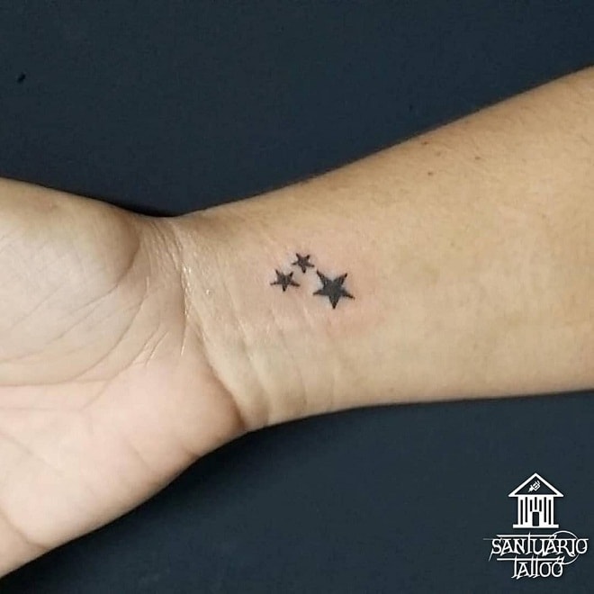 Three Tiny Stars Tattoos in hand
