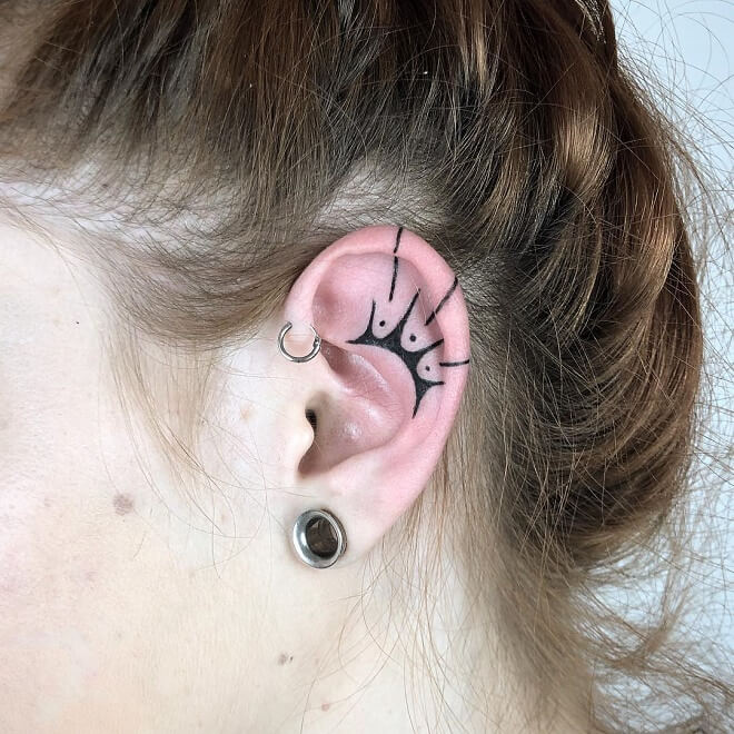Dark Ear Tattoo