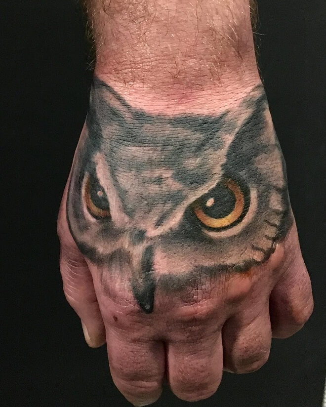 Hand On Owl Tattoo
