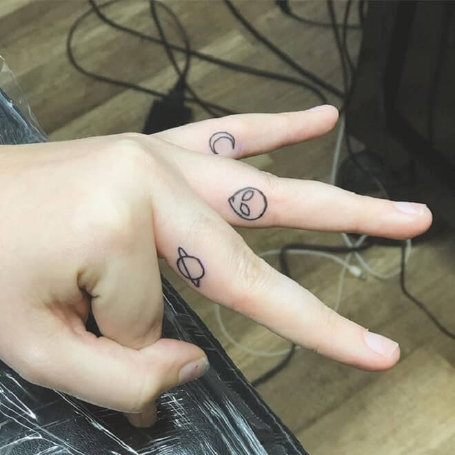 Black Finger Tattoo