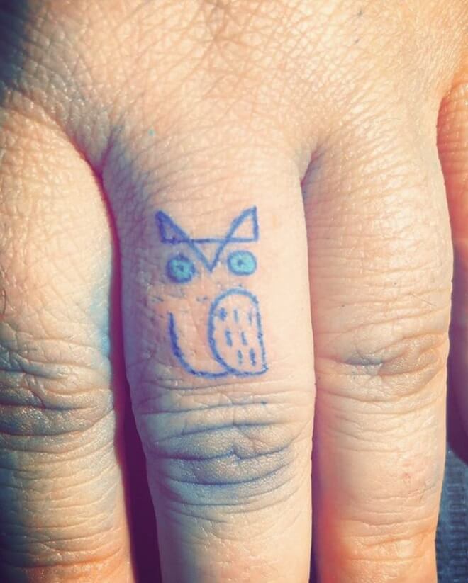 Blue Finger Tattoo