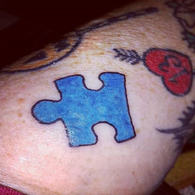 Blue Puzzle Piece Tattoo