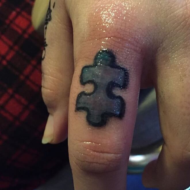 Finger Puzzle Piece Tattoo