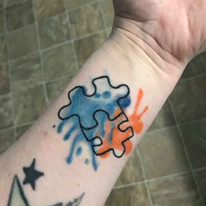 Hand Puzzle Piece Tattoo