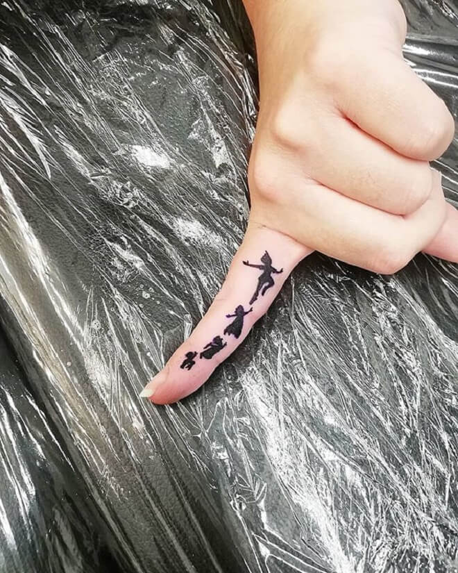 Finger Peter Pan Tattoo