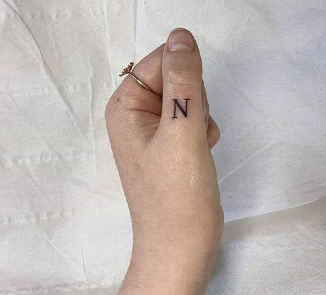 Thumb Letter Tattoo