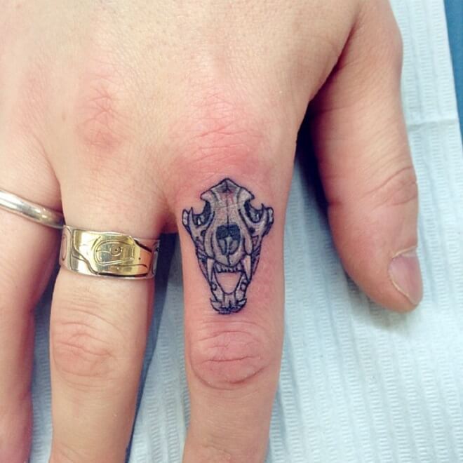 Finger Lion Skull Tattoo