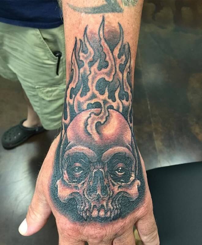 Flaming Skull Hand Tattoo