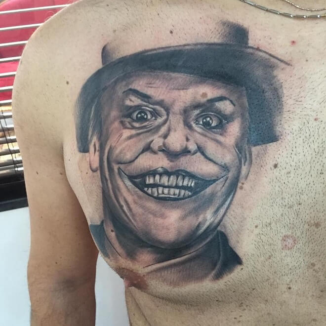 Joker smile tattoo