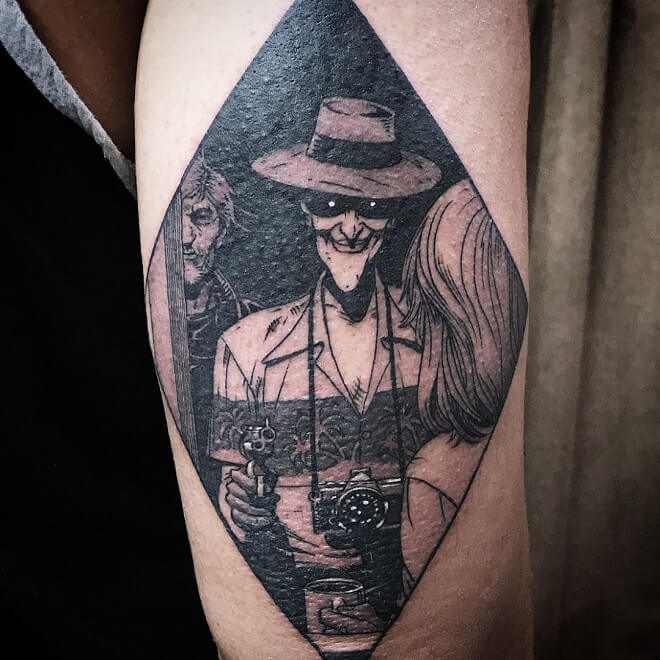 Joker with gun tattoo